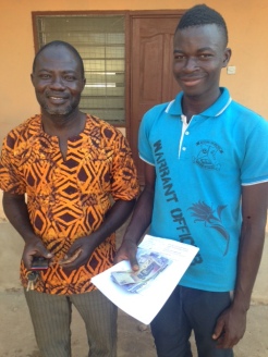 Gunwagre headmaster Agua and entering high school student Dennis. They stopped at our room on the way to pay school fees.